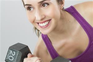 Woman lifting hand weight